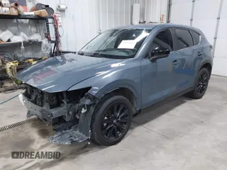 2021 Mazda CX-5 Touring z VIN JM3KFBCM4M0459465, wystawiony jako IAAI lot #41059836 z przebiegiem 74 645 mil mil oraz . Historia ofert i sprzedaży dostępna na DreamBid. Obrazek 2.
