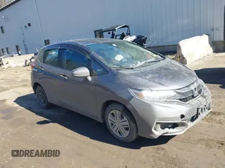2018 Honda Fit LX z VIN 3HGGK5G44JM716592, wystawiony jako IAAI lot #41878820 z przebiegiem 70 464 mil mil oraz . Historia ofert i sprzedaży dostępna na DreamBid. Obrazek 1.