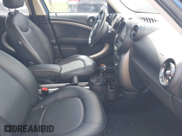 2014 MINI Countryman with VIN WMWZB3C52EWR40215, listed as a IAAI auction lot 42687571 with 106,338 mi miles and . Bid and sale history available at DreamBid. Image 5.