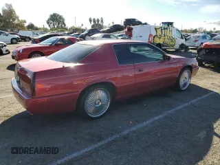 1999 Cadillac Eldorado Touring z VIN 1G6ET1293XU611368, wystawiony jako Copart lot #82683114 z przebiegiem 126 178 mil mil oraz Szkody całkowita. Historia ofert i sprzedaży dostępna na DreamBid. Obrazek 3.