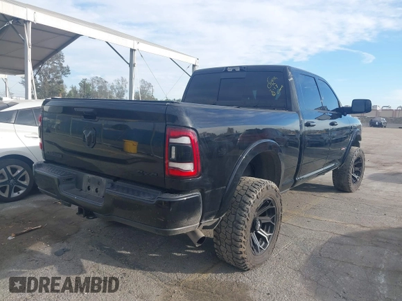 2021 Ram 2500 Laramie z VIN 3C6UR5FL7MG590681, wystawiony jako IAAI lot #41679165 z przebiegiem 28 482 mil mil oraz . Historia ofert i sprzedaży dostępna na DreamBid. Obrazek 4.