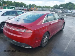 2015 Lincoln MKZ z VIN 3LN6L2GK8FR616005, wystawiony jako IAAI lot #42804770 z przebiegiem 241 352 mil mil oraz . Historia ofert i sprzedaży dostępna na DreamBid. Obrazek 4.