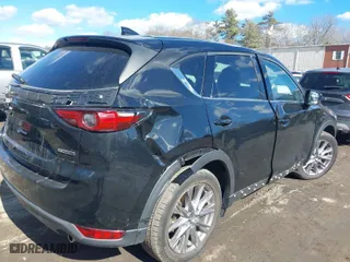 2021 Mazda CX-5 Grand Touring with VIN JM3KFBDM3M1318248, listed as a IAAI auction lot 41678260 with 71,903 mi miles. Bid and sale history available at carsss.com. Image 4.