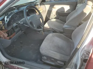 2001 Kia Sephia z VIN KNAFB121115074609, wystawiony jako Copart lot #72346144 z przebiegiem 88 400 mil mil oraz Tytuł czysty. Historia ofert i sprzedaży dostępna na DreamBid. Obrazek 7.