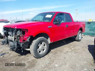 2005 Ford F-150 STX with VIN 1FTRX14W25NA45992, listed as a IAAI auction lot 41702409 with 202,867 mi miles. Bid and sale history available at carsss.com. Image 2.