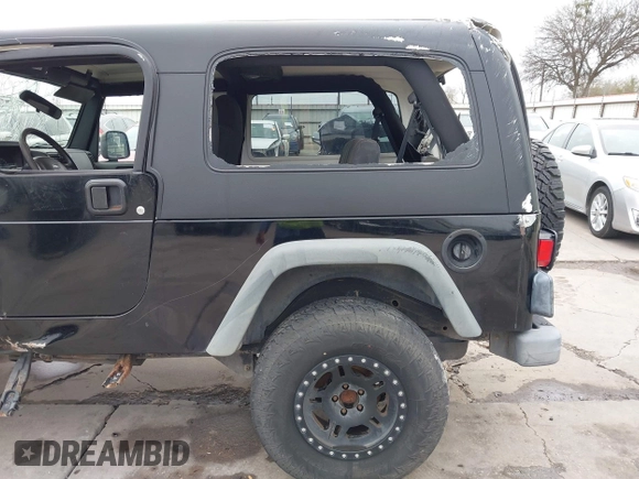 2004 Jeep Wrangler Sport with VIN 1J4FA49S64P794559, listed as a IAAI auction lot 41644201 with 107,445 mi miles. Bid and sale history available at carsss.com. Image 20.
