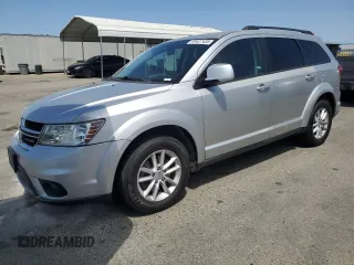 2013 Dodge Journey SXT with VIN 3C4PDCBG1DT659969, listed as a Copart auction lot 59427435 with 177,811 mi miles and Salvage title. Bid and sale history available at DreamBid. Image 1.