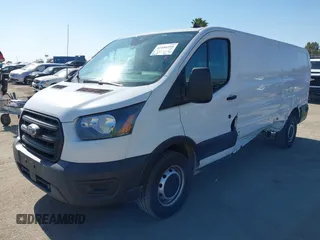 2020 Ford Transit Cargo with VIN 1FTBR1Y83LKA67103, listed as a IAAI auction lot 42408599 with 76,837 mi miles and . Bid and sale history available at DreamBid. Image 2.
