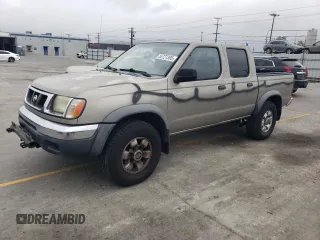 2000 Nissan Frontier XE with VIN 1N6ED27T8YC357939, listed as a Copart auction lot 55727395 with 143,842 mi miles and Salvage title. Bid and sale history available at DreamBid. Image 1.