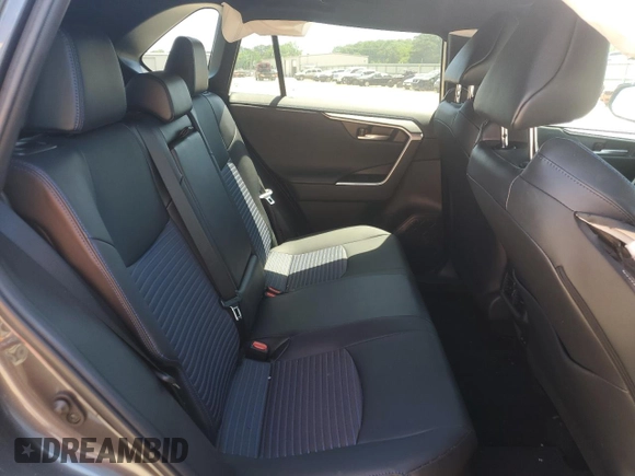 2023 Toyota RAV4 Hybrid XSE with VIN 2T3E6RFV9PW039963, listed as a Copart auction lot 57594335 with 27,486 mi miles and Salvage title. Bid and sale history available at DreamBid. Image 11.