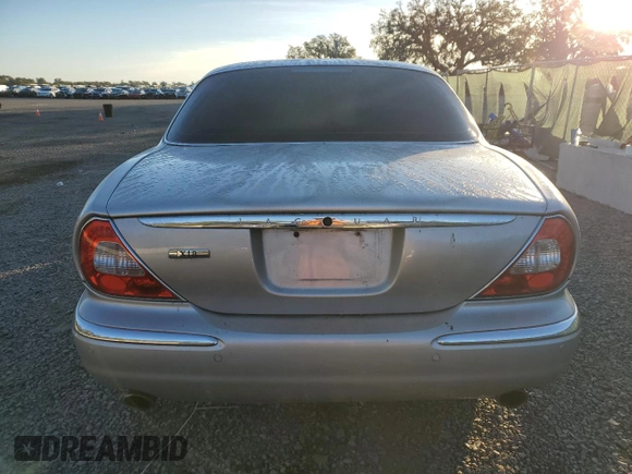 2004 Jaguar XJ with VIN SAJWA71C84SG32106, listed as a Copart auction lot 81837704 with 119,268 mi miles and Salvage Title. Bid and sale history available at carsss.com. Image 6.