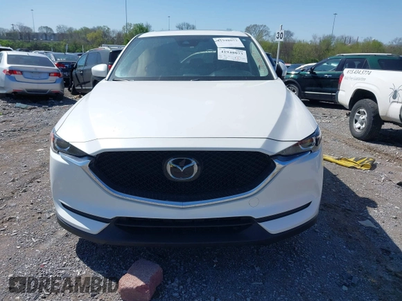2021 Mazda CX-5 Touring z VIN JM3KFBCM2M1395663, wystawiony jako IAAI lot #41948073 z przebiegiem 47 029 mil mil oraz . Historia ofert i sprzedaży dostępna na DreamBid. Obrazek 12.