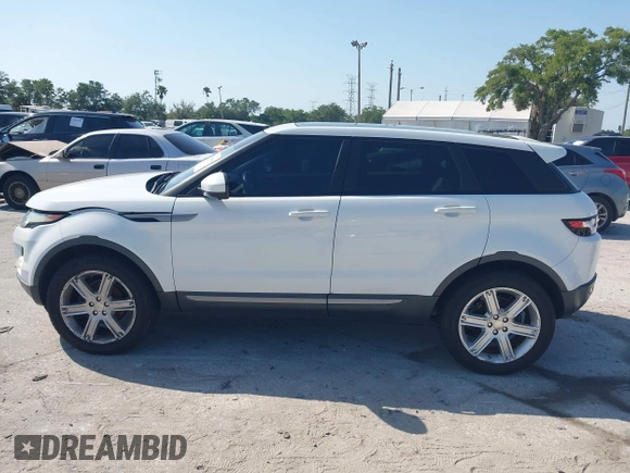 2015 Land Rover Range Rover Evoque Pure Premium z VIN SALVR2BG0FH964683, wystawiony jako IAAI lot #42016766 z przebiegiem 94 942 mil mil oraz . Historia ofert i sprzedaży dostępna na DreamBid. Obrazek 14.