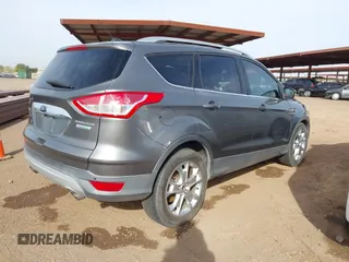 2014 Ford Escape Titanium with VIN 1FMCU0JX5EUC00297, listed as a IAAI auction lot 41928316 with 146,406 mi miles. Bid and sale history available at carsss.com. Image 4.