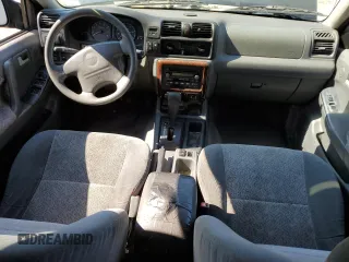 2002 Isuzu Rodeo S z VIN 4S2CK58W924321032, wystawiony jako Copart lot #66145264 z przebiegiem 184 325 mil mil oraz Szkody całkowita. Historia ofert i sprzedaży dostępna na DreamBid. Obrazek 8.