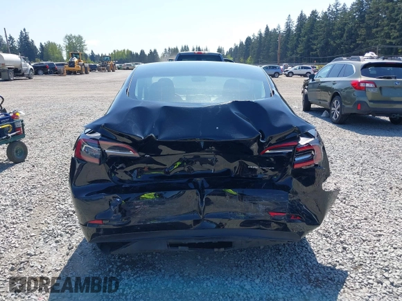 2022 Tesla Model 3 Long Range with VIN 5YJ3E1EB7NF241996, listed as a IAAI auction lot 42115915 with 23,433 mi miles and . Bid and sale history available at DreamBid. Image 6.