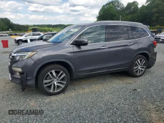 2017 Honda Pilot Touring with VIN 5FNYF5H97HB007641, listed as a Copart auction lot 54769865 with 128,975 mi miles and Salvage title. Bid and sale history available at DreamBid. Image 1.