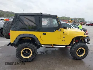 2000 Jeep Wrangler SE with VIN 1J4FA29P5YP705215, listed as a IAAI auction lot 41920532 with 92,927 mi miles and . Bid and sale history available at DreamBid. Image 14.