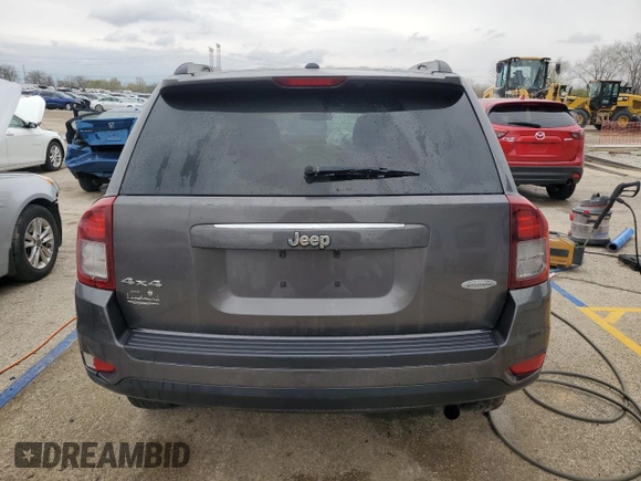 2014 Jeep Compass Latitude with VIN 1C4NJDEB4ED904731, listed as a Copart auction lot 51809165 with 104,760 mi miles and Salvage Title. Bid and sale history available at DreamBid. Image 6.