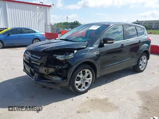 2013 Ford Escape SEL with VIN 1FMCU9HX1DUB97939, listed as a IAAI auction lot 42293561 with 196,951 mi miles and . Bid and sale history available at DreamBid. Image 2.