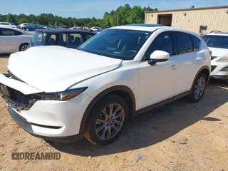 2021 Mazda CX-5 Grand Touring with VIN JM3KFBDM3M0493752, listed as a IAAI auction lot 42456854 with 35,122 mi miles and . Bid and sale history available at DreamBid. Image 2.