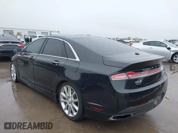 2015 Lincoln MKZ z VIN 3LN6L2G90FR621891, wystawiony jako IAAI lot #41968088 z przebiegiem 128 988 mil mil oraz . Historia ofert i sprzedaży dostępna na DreamBid. Obrazek 3.