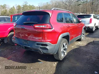 2014 Jeep Cherokee Trailhawk with VIN 1C4PJMBS0EW257133, listed as a IAAI auction lot 41446095 with 82,285 mi miles and . Bid and sale history available at DreamBid. Image 4.