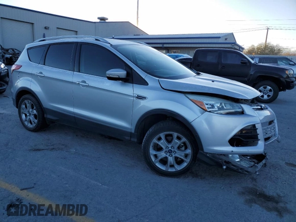 2016 Ford Escape Titanium with VIN 1FMCU9J95GUA69932, listed as a Copart auction lot 88470175 with 108,471 mi miles and Salvage title. Bid and sale history available at DreamBid. Image 4.