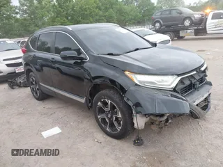 2017 Honda CR-V Touring with VIN 2HKRW2H96HH672017, listed as a IAAI auction lot 42151118 with 144,527 mi miles and . Bid and sale history available at carsss.com. Image 1.