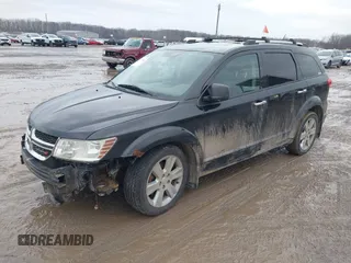 2013 Dodge Journey R/T with VIN 3C4PDDFG7DT724534, listed as a IAAI auction lot 41161346 with 175,606 mi miles and . Bid and sale history available at DreamBid. Image 2.