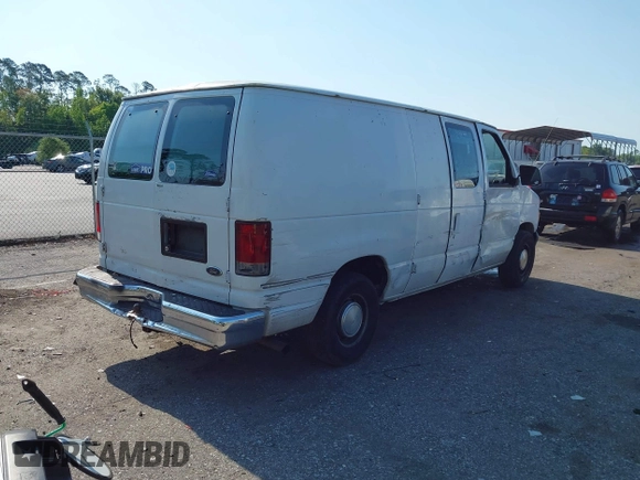 1999 Ford Econoline Cargo with VIN 1FTRE1420XHA34056, listed as a IAAI auction lot 41998411 with 236,267 mi miles. Bid and sale history available at carsss.com. Image 4.