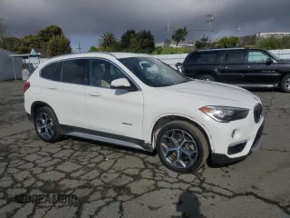 2017 BMW X1 sDrive28i with VIN WBXHU7C33H5H32827, listed as a Copart auction lot 50348265 with 117,412 mi miles and Salvage Title. Bid and sale history available at carsss.com. Image 4.