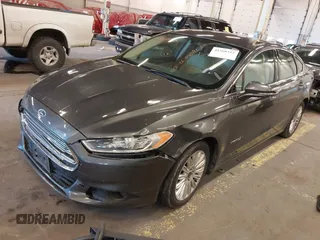 2016 Ford Fusion SE Hybrid with VIN 3FA6P0LU9GR235291, listed as a IAAI auction lot 41560312 with 112,777 mi miles. Bid and sale history available at carsss.com. Image 16.
