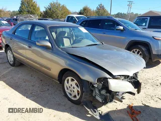 1999 Mazda 626 LX with VIN 1YVGF22D8X5871485, listed as a IAAI auction lot 41641049 with 115,603 mi miles. Bid and sale history available at carsss.com. Image 1.