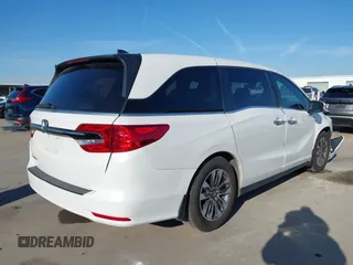 2023 Honda Odyssey EX-L with VIN 5FNRL6H66PB029475, listed as a IAAI auction lot 41128411 with 49,662 mi miles. Bid and sale history available at carsss.com. Image 4.