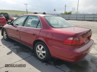 2000 Honda Accord SE with VIN JHMCG5677YC016067, listed as a Copart auction lot 54243735 with 155,183 mi miles and Salvage title. Bid and sale history available at DreamBid. Image 2.