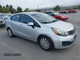2014 Kia Rio LX with VIN KNADM4A3XE6363851, listed as a IAAI auction lot 42111189 with 144,122 mi miles and . Bid and sale history available at DreamBid. Image 1.