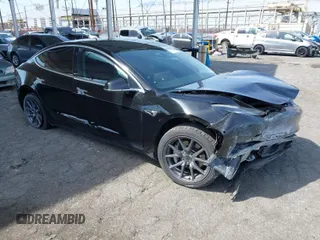 2019 Tesla Model 3 Mid Range with VIN 5YJ3E1EA1KF410297, listed as a IAAI auction lot 41841991 with 176,254 mi miles. Bid and sale history available at carsss.com. Image 1.