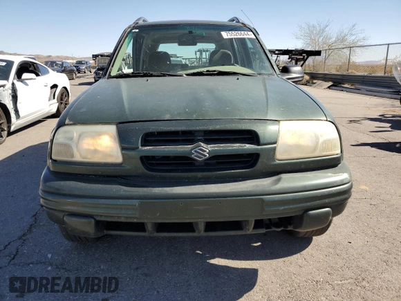 2000 Suzuki Vitara JX z VIN 2S3TD52V1Y6108459, wystawiony jako Copart lot #75526644 z przebiegiem 263 433 mil mil oraz Szkody całkowita. Historia ofert i sprzedaży dostępna na DreamBid. Obrazek 5.