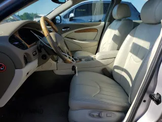 2002 Jaguar S-Type with VIN SAJDA01P52GM27504, listed as a Copart auction lot 57850944 with 119,707 mi miles and Clean Title. Bid and sale history available at DreamBid. Image 7.