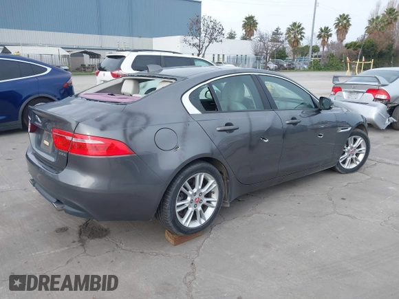 2017 Jaguar XE 25t Premium with VIN SAJAD4BG0HA975017, listed as a IAAI auction lot 41589536 with 40,136 mi miles. Bid and sale history available at carsss.com. Image 4.