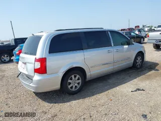 2012 Chrysler Town & Country Touring with VIN 2C4RC1BG5CR210473, listed as a IAAI auction lot 41939429 with 174,400 mi miles. Bid and sale history available at carsss.com. Image 4.