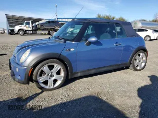 2005 MINI Convertible S with VIN WMWRH33445TF82318, listed as a Copart auction lot 87230444 with 88,199 mi miles and Salvage Title. Bid and sale history available at DreamBid. Image 1.