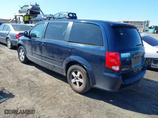 2013 Dodge Grand Caravan SXT with VIN 2C4RDGCGXDR527973, listed as a IAAI auction lot 41930036 with 111,985 mi miles. Bid and sale history available at carsss.com. Image 3.