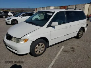 2002 Honda Odyssey EX-L with VIN 2HKRL18942H582973, listed as a Copart auction lot 46918055 with 210,132 mi miles and Salvage title. Bid and sale history available at DreamBid. Image 1.