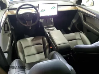 2024 Tesla Model Y Long Range с VIN 7SAYGDEE1RF201627, выставлен на аукционе Copart как лот 60631195 с пробегом 14 356 миль миль и Списание • Salvage title. История ставок и продаж доступна на DreamBid. Изображение 8.