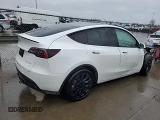 2022 Tesla Model Y Long Range with VIN 7SAYGDEE1NF491488, listed as a Copart auction lot 49266945 with 44,703 mi miles and Salvage Title. Bid and sale history available at carsss.com. Image 3.