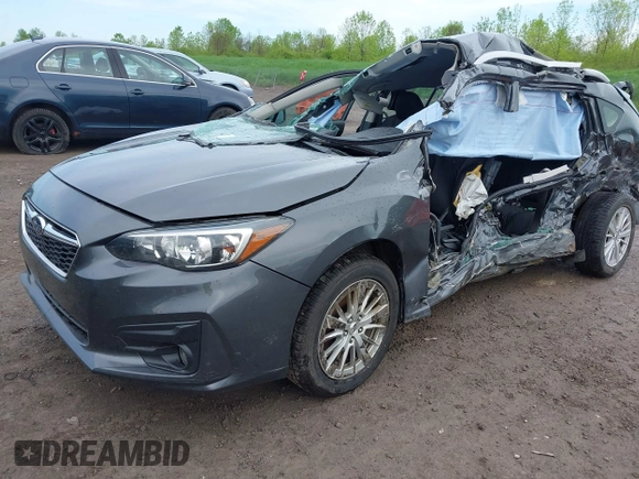 2018 Subaru Impreza Premium z VIN 4S3GTAD67J3701533, wystawiony jako IAAI lot #42157704 z przebiegiem 63 999 mil mil oraz . Historia ofert i sprzedaży dostępna na DreamBid. Obrazek 2.