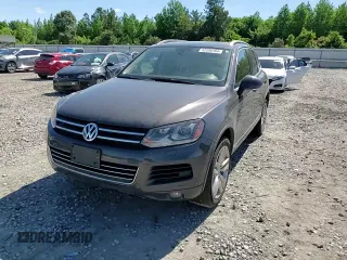 2013 Volkswagen Touareg Lux with VIN WVGEF9BP8DD002947, listed as a Copart auction lot 52590164 with 144,831 mi miles and Salvage Title. Bid and sale history available at DreamBid. Image 12.