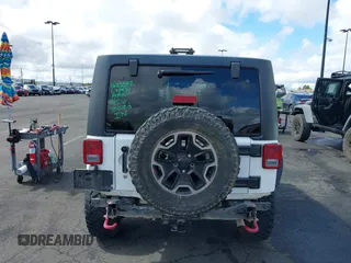 2016 Jeep Wrangler Unlimited Rubicon with VIN 1C4HJWFG7GL254143, listed as a IAAI auction lot 41781962 with 114,435 mi miles and . Bid and sale history available at DreamBid. Image 17.